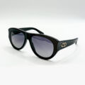Lunettes de soleil Dior noires avec logo CD doré sur les branches