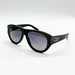Lunettes de soleil Dior noires avec logo CD doré sur les branches