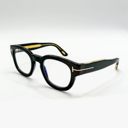 Monture optique Tom Ford noire avec détail T doré à Bruxelles