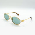 Lunettes de soleil Miu Miu dorées à verres verts à Bruxelles